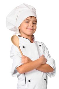 girl chef with wooden spoon isolated on white background